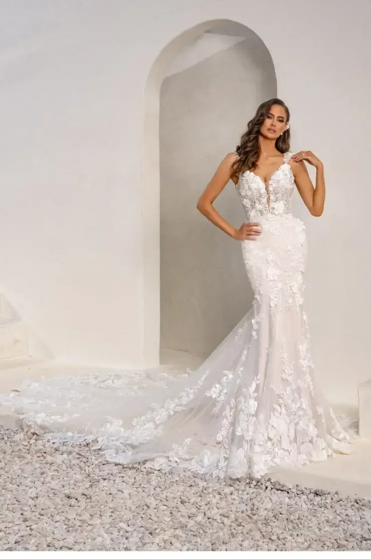 model is wearing a lace fit and flare bridal gown