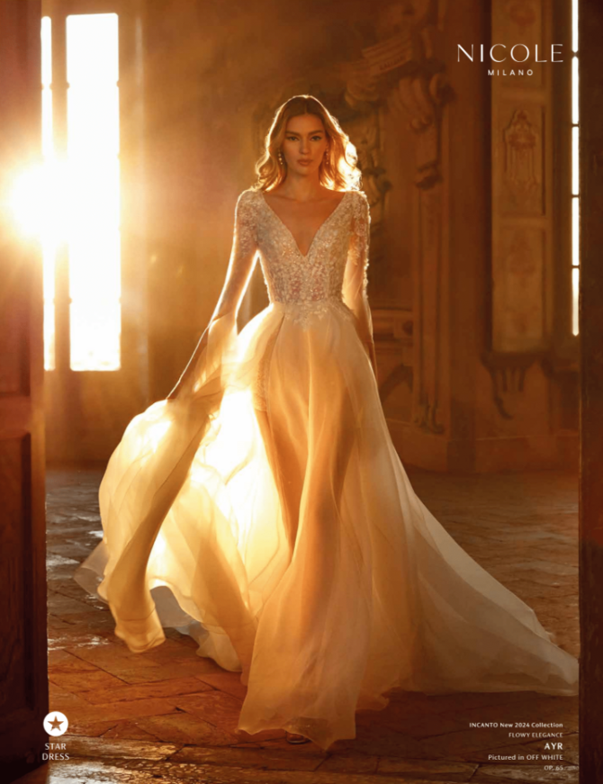 Nicole Milano Ayr wedding dress Flow A-line with V-neck and long sleeves by Crystal Bridal Nicole Milano Ayr wedding dress Flow A-line with V-neck and long sleeves by Crystal Bridal